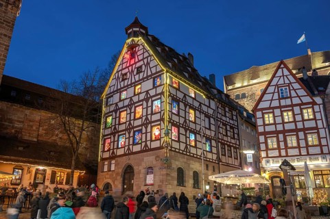 Historic Pilkatushaus with an Advent calendar on 18 December 2024 at dusk, behind the Imperial