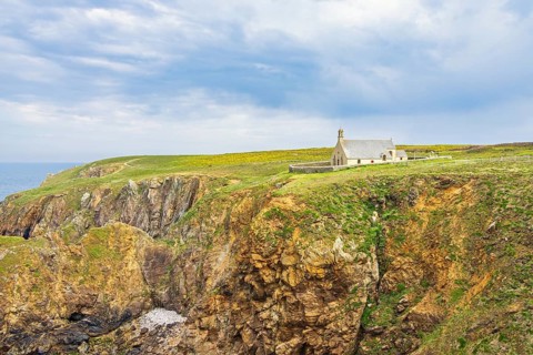 Old Chapelle Saint-They at a barren rocky coast on Pointe du Van in Bretagne, Crozon peninsula,