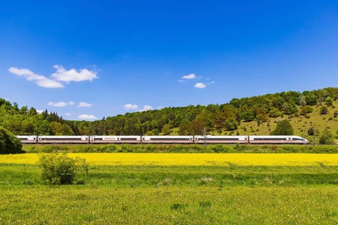 InterCityExpress ICE travelling across the Swabian Alb. Idyllic landscape in spring. Lonsee,