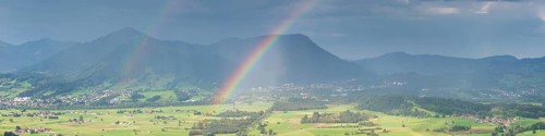 Panorama from the Grünten over the Illertal with rainbow to Blaichach and Immenstadt, behind