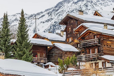 Old snow-covered wooden houses in the historic village centre, Grimentz, Val d'Anniviers, Valais