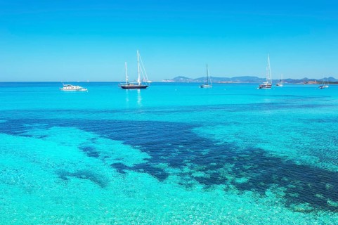 Sailing boats anchored at Ses Illetes beach, Formentera, Balearic Islands, Spain