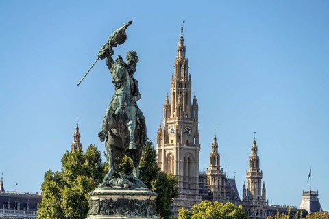 The equestrian statue of Archduke Karl on Heldenplatz and the City Hall in Vienna, Austria