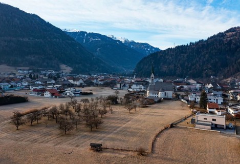 Drone shot, view of village with parish church, Prutz, Kaunertal, Inntal, Tyrol, Austria