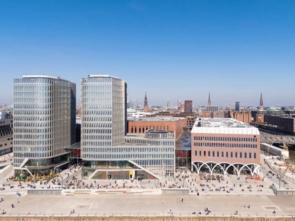 Aerial view of Westfield shopping centre with glass facades surrounded by urban landscape in