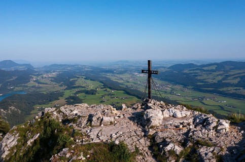 Summit cross on the Schober with view to Thalgau, Osterhorn group, Salzkammergut, Salzburg