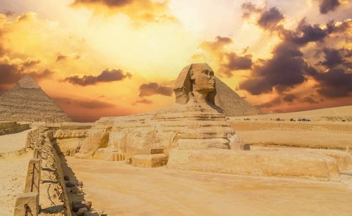 The Great Sphinx of Giza and in the background the Pyramids of Giza, the oldest Funerary monument