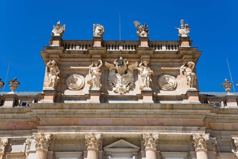 Detailed baroque façade art of a palace under a clear blue sky, Royal Castle La Granja, Palace,