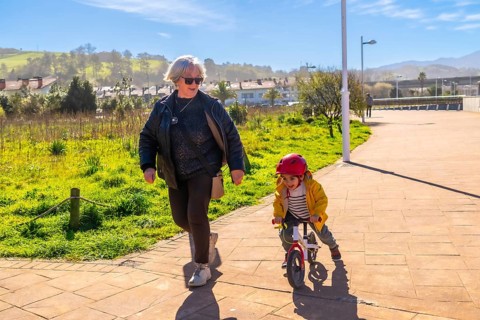Grandmother and grandson enjoying time together outdoors, promoting family bonding and healthy