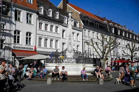 People at the market fountain, Saarbrücken, Saarland, Germany