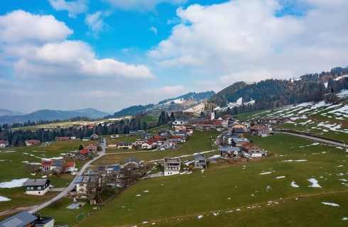 Drone image, residential buildings, settlement area, parish church, Riefensberg, Bregenzerwald,