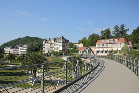 View from the Schweizerhaus Bridge over the Franconian Saale with Fürstenhof in Bad Kissingen,