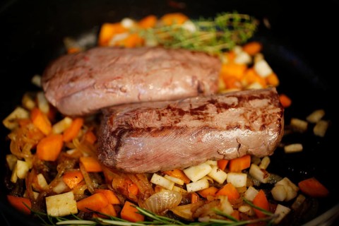 Swabian cuisine, preparation of roast venison, game dish, sautéing vegetables, frying pan, carrots,