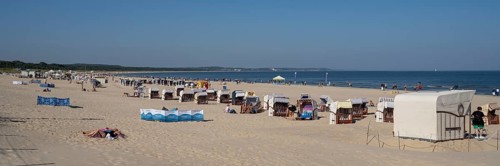 Beach chairs and tourists on the sandy beach, Swinemünde, Usedom Island, Baltic Sea, Poland