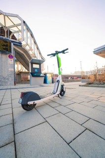 E-scooter on paving stones in front of modern urban architecture in bright daylight, Sindelfingen,