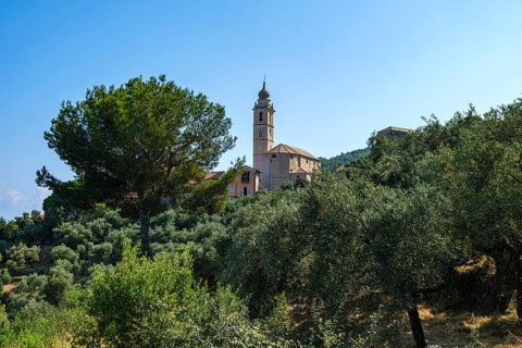 Picturesque view of the Parrocchia Ss. Trinita, the church in the village of Rollo near Andora,