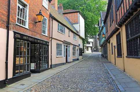 Historic buildings in Elm Hill cobbled lane street, Norwich, Norfolk, England, UK