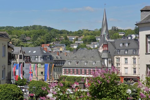 View of market square with historic town hall and twisted tower of St. Clemens church, national