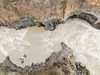 Aerial view of waterfall Aldeyarfoss, canyon of volcanic basalt columns, Þingeyjarsveit, Norðurland