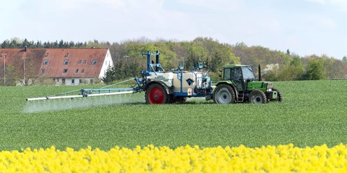 Agriculture, pesticide being sprayed on a field in spring, Swabian Alb, Baden-Württemberg, Germany