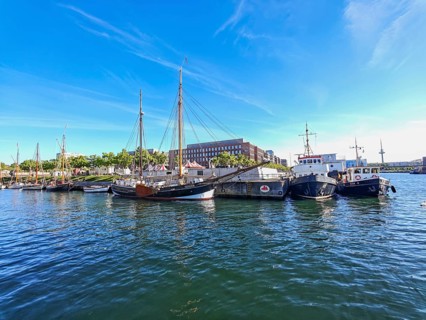 View of the eastern shore with the Germania harbour for traditional sailing ships and the new brick