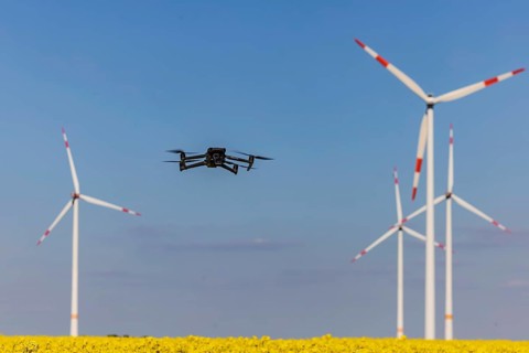 A Mavic 3 Pro drone flies for a wind turbine in a wind farm. Dornstadt, Baden-Württemberg, Germany