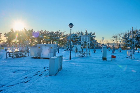 Weather station with snow-covered facilities at sunrise, winter, Wasserkuppe, Gersfeld, Rhön,