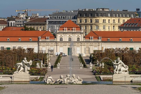 Fountain in the palace gardens and the Lower Belvedere in Vienna, Austria