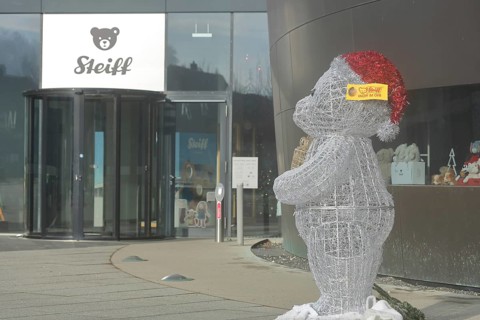 Entrance to the Steiff Museum with bear figure at Christmas time, teddy bear with button in ear as