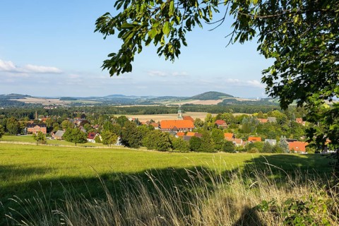 View of the village from the Sängerhöhe with church, school and half-timbered houses, in the