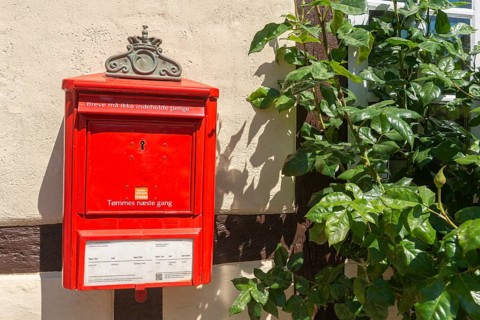 Odense, Old Town, red letterbox, notices, letter must not contain money, emptying Tuesday, post