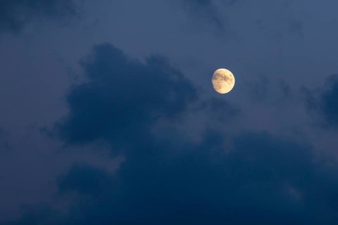 Moon in a slightly cloudy evening sky, Germany
