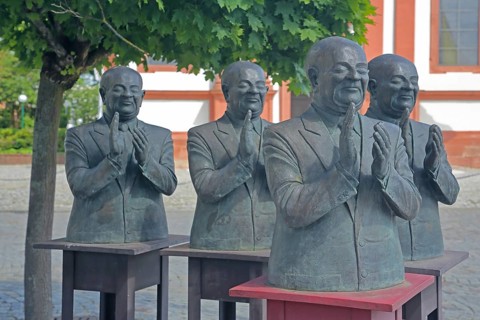 The Claque by Guido Messer, bronze sculpture, modern art, frame, four men clapping with hands,