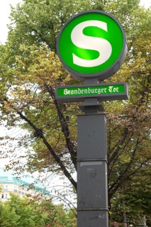 S-Bahn station 'Brandenburg Gate', pillar with backlit sign in green and white, tram, station,