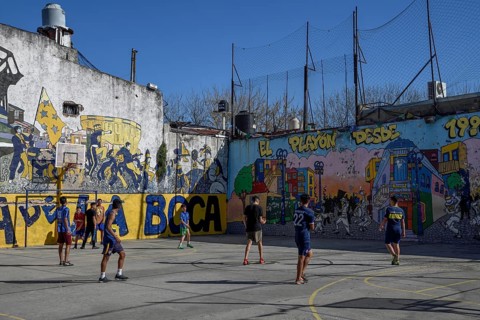 Young footballers on a football field, La Boca district, Buenos Aires, Argentina
