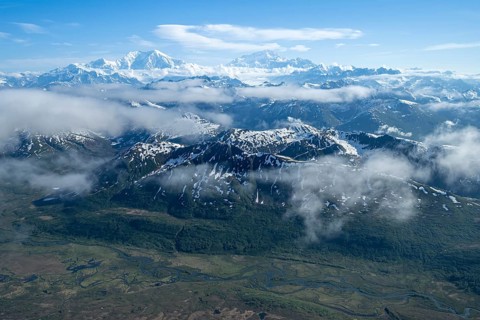 Clouds over high mountains, Mt Foraker and Mt Denali or Mount McKinley, aerial view, Alaska Range,
