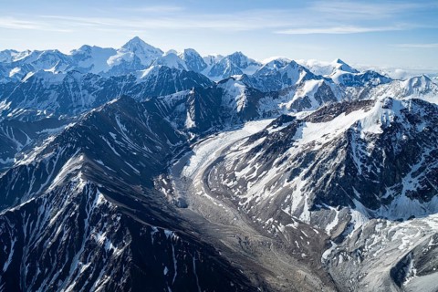 Snow and ice, epic mountains with glaciers, aerial view, Alaska Range, Denali National Park,
