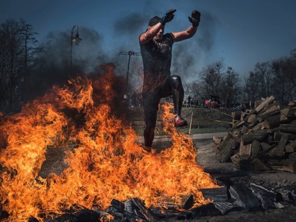 WROCLAW, POLAND - APRIL 7, 2018: Extreme running with obstacle RUNMAGEDDON. In the picture a runner