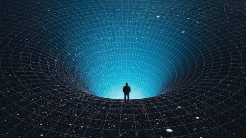A man stands at the edge of a black hole, gazing into the depths of the universe, surrounded by