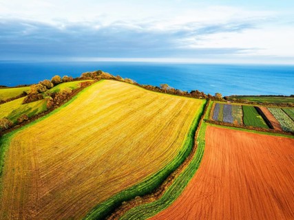 Colours of autumn Fields and Farms over Sheldon from a drone, Torbay, Devon, England, United