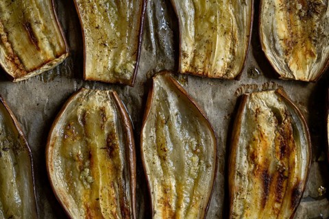 Close-up of oven-roasted eggplant slices, perfectly baked for a healthy vegetarian meal. The rich