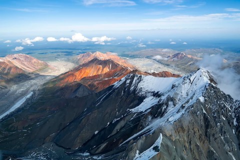 Glacier bed and colored mountains, aerial view, Alaska Range, Denali National Park, Alaska, USA