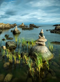 Rocky coast with cairns, Allinge-Sandvig, Bornholm, Denmark
