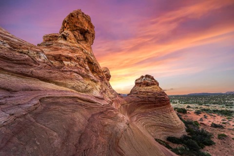 Capture the breathtaking sunset over the unique sandstone formations of Coyote Buttes in the Paria