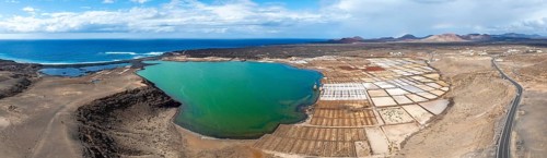 Salt mining plant, Salinas de Janubio with green Laguna de Janubio, near Yaiza, aerial view,