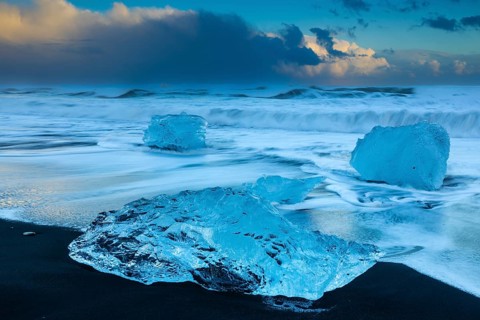 Ice chunks on the black beach, lava beach, glacier ice, sea, winter, sunset, Diamond Beach