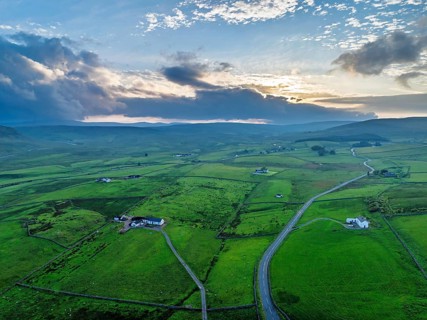 Forest in Teesdale over River Tees from a drone, North Pennines AONB, County Durham, England,