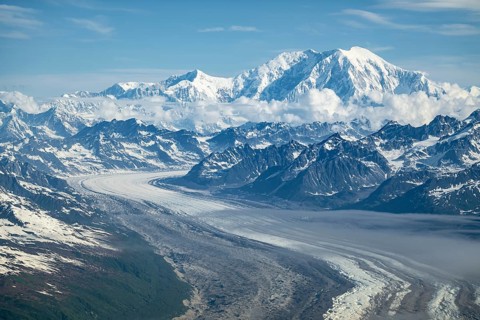 Clouds over high mountains, Mt Foraker with Kahlitna Glacier, aerial view, Alaska Range, Denali