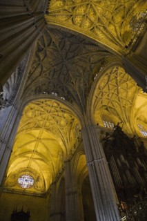 Architectural details on ceiling and stained glass rose window in Interior of The Cathedral of