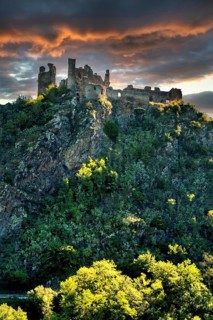 Village of Saint-Remy-de-Biot, the medieval castle in ruins of Chateau Rocher at sunset (15th